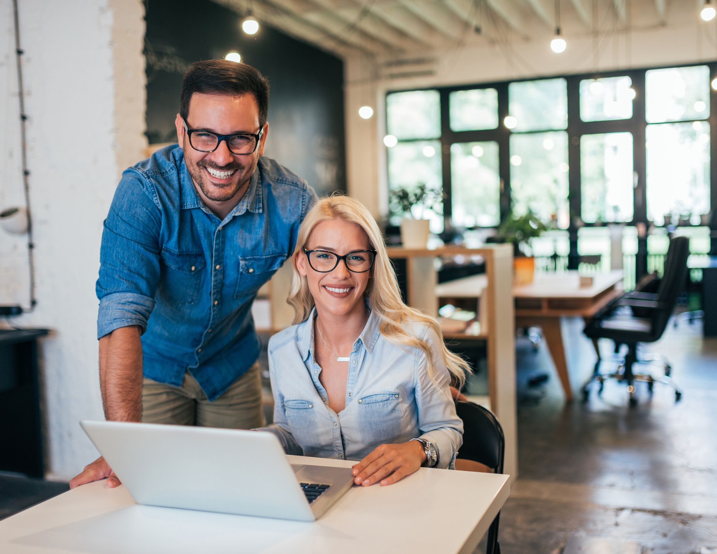 Couple smiling and receiving online coaching